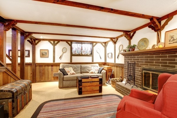 Warm rustic furnished living room with a fireplace