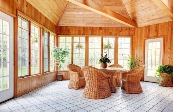Wooden Wall Sun Room Interior with Wicker Furniture