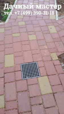 Дождеприемный колодец на дорожке